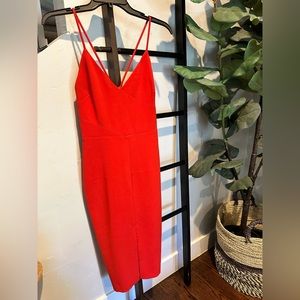 Candy apple red midi dress with cute ribbing detail and mini front slit